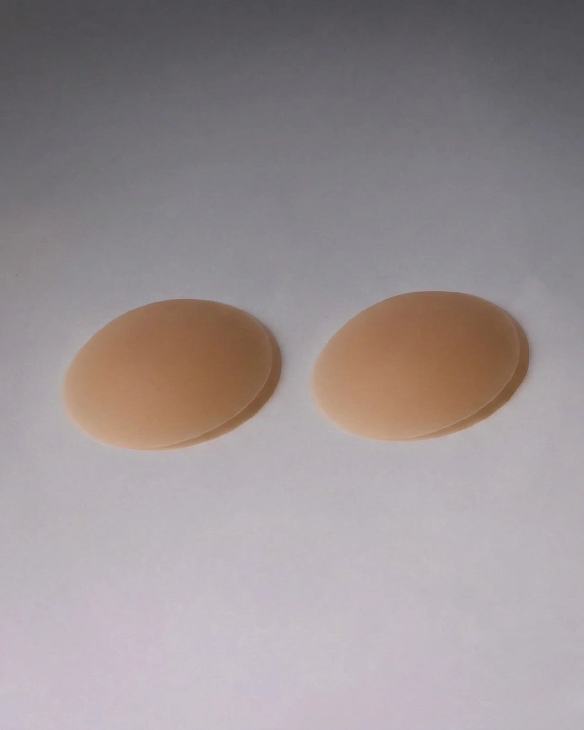 SLIMZ reusable silicone nipple covers, pair shown flat on a white background