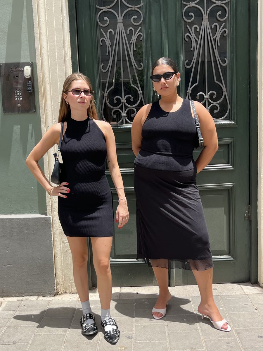 Two SLIMZ customers in black SLIMZ dresses